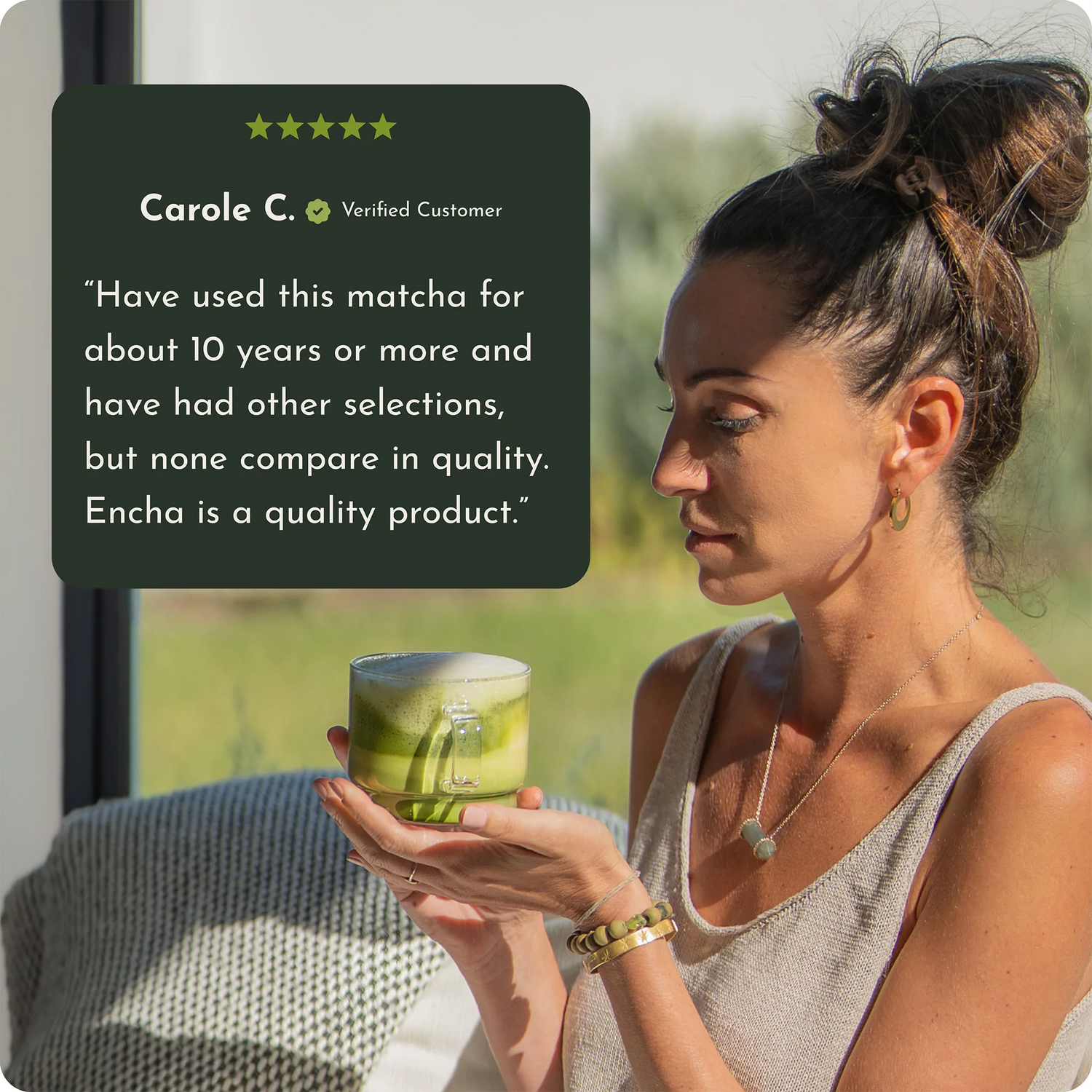 A woman in a beige sleeveless top holds a glass of matcha tea in a bright indoor setting with a large window. A dark green customer review card is overlaid on the left, featuring a five-star rating and the name Carole C.  _30g (1.02oz) 15 cups _60g (2.12oz) 30 cups _500g (17.64oz) 250 cups
