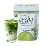 A pouch of Encha Matcha Ceremonial Grade Latte next to a glass of iced matcha latte on a white background.  _60g (2.12oz) 30 cups
