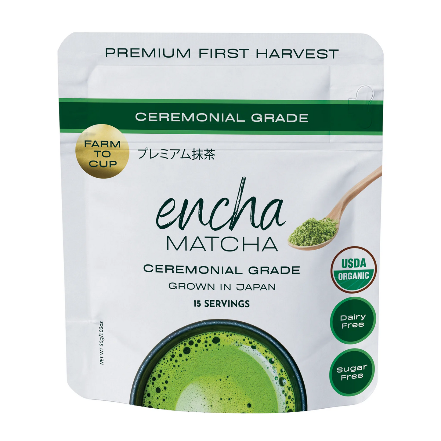 A stand-up pouch of Encha Matcha ceremonial grade matcha tea on a plain white background. The packaging is white with green accents, featuring a green matcha powder scoop illustration, a gold 'Farm to Cup' seal, and circular badges indicating USDA Organic, dairy free, and sugar free. _30g (1.06oz) 15 cups
