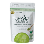 A stand-up pouch of Encha Matcha ceremonial grade latte, featuring a white package with green accents, a green matcha sphere graphic, and a small spoonful of green powder on a white background.  _500g (17.64oz) 250 cups