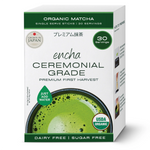 A box of Encha Ceremonial Grade organic matcha tea single-serve sticks, 30 servings. The packaging is white with green accents, featuring a photo of green matcha tea at the bottom and badges for 'Grown in Japan' and 'USDA Organic'. _Single serve sticks 30 pack