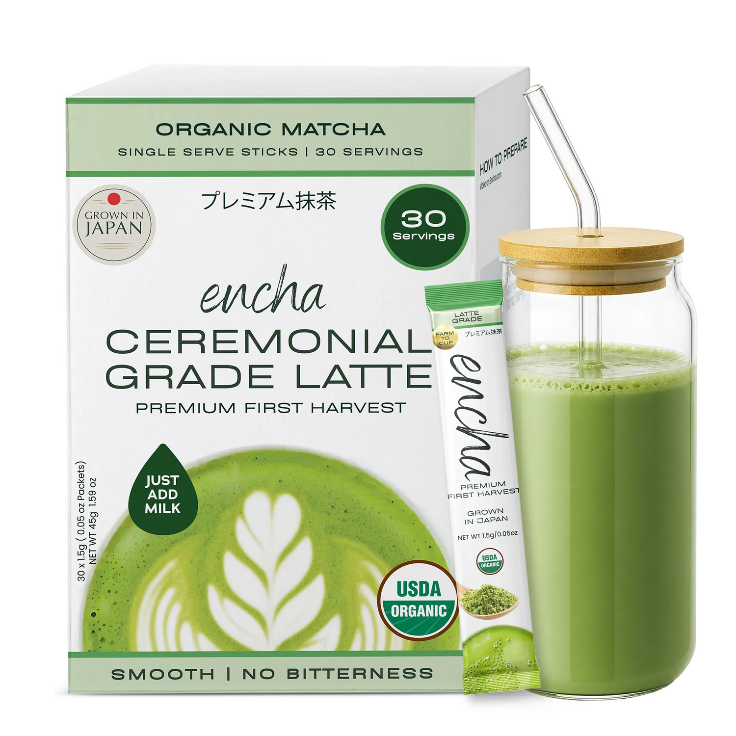 A box of Encha Ceremonial Grade Latte organic matcha single-serve sticks next to a glass jar filled with green matcha latte and a bamboo lid with a clear straw, on a white background. _Single serve sticks 30 pack