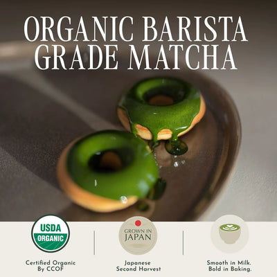 Promotional graphic for organic barista grade matcha, featuring two glossy green matcha-glazed donuts on a dark plate with large white text reading 'ORGANIC BARISTA GRADE MATCHA' and three certification/benefit icons along the bottom.
