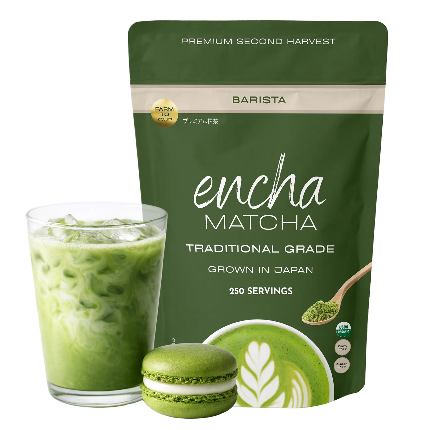 A pouch of Encha Matcha Traditional Grade matcha powder next to a glass of green iced matcha latte and a green matcha macaron, on a white background. _500g (17.64oz) 250 cups
