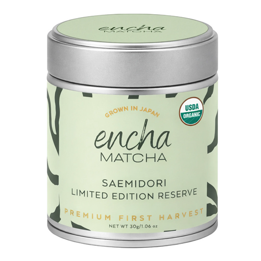A cylindrical metal tin of Encha Matcha Saemidori Limited Edition Reserve, featuring a pale green label with black text and a silver lid, on a white background.